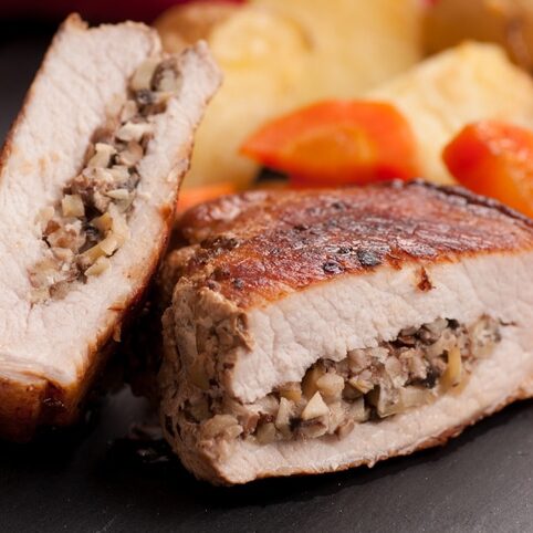 pork chop stuffed with apple with potatoes and carrots